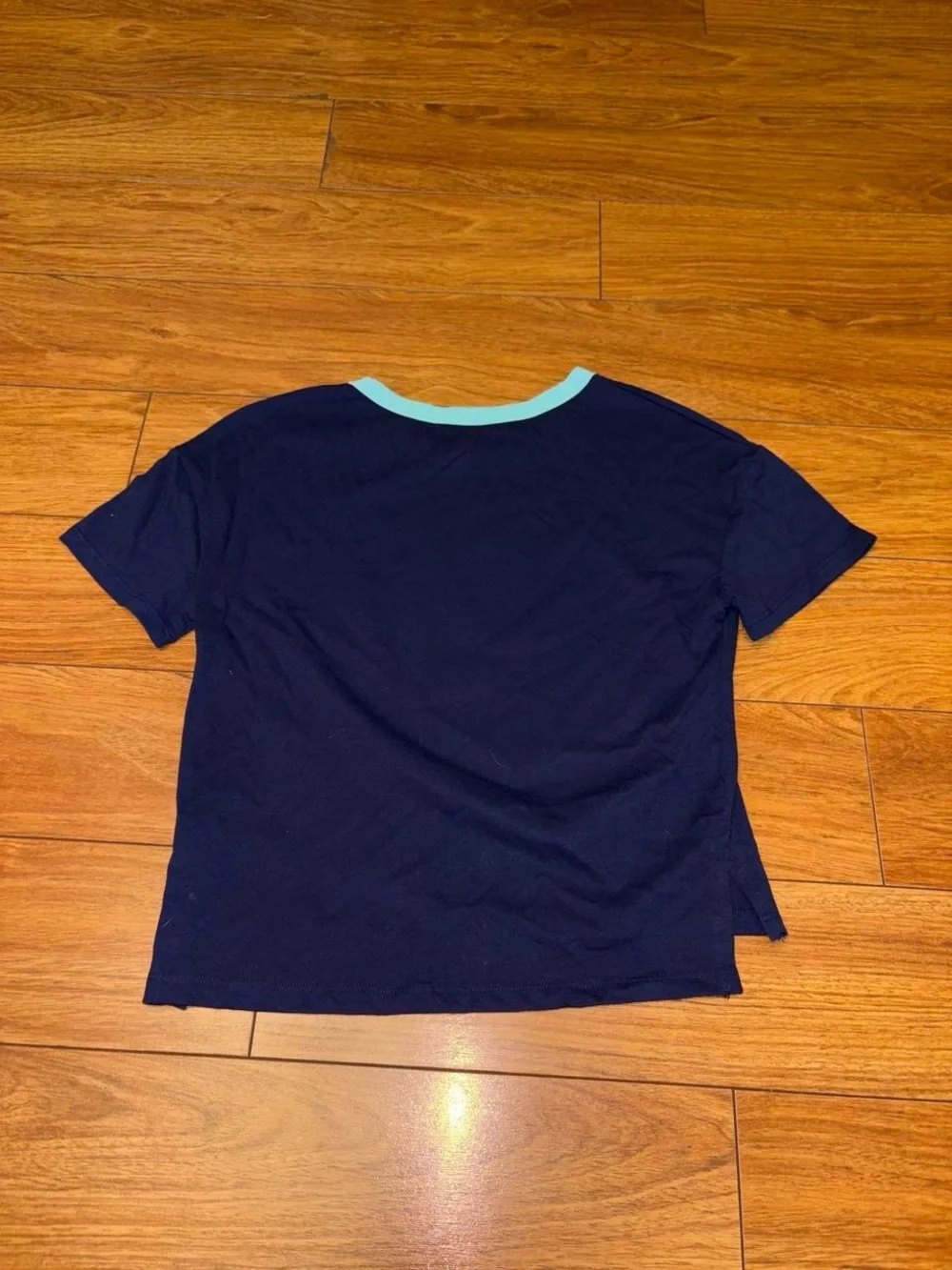 Y2K Justice navy blue tee with white lightning bolt graphic